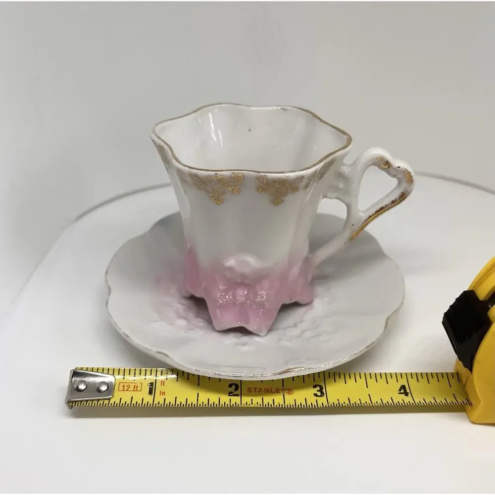 Antique Footed Teacup And Saucer